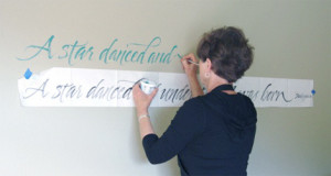 Writing a Shakespeare quote with acrylic paint for a client. The paper ...
