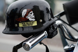 Chronicle file A helmet rests on a Harley-Davidson motorcycle parked ...