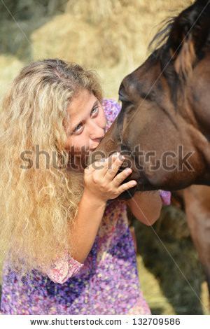 ... -photo-young-blonde-girl-kissing-her-horse-on-the-nose-132709586.jpg