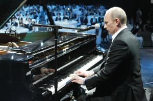 Prime Minister Vladimir Putin plays piano during a charity concert ...