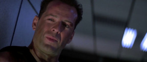 Photo of John McClane , as portrayed by Bruce Willis in 