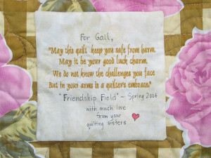 label on a cancer comfort quilt made by quilters who had each signed