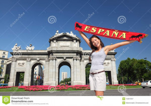 Spain - Madrid Tourist holding Espana banner in front of Puerta de ...