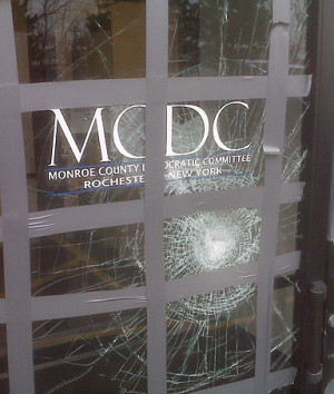 ... in Rochester, N.Y. shows damage to their office after a glass door
