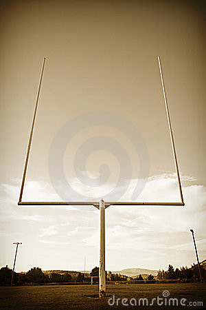 Football field goal posts in a vintage, rustic, sepia toned style. low ...