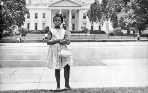 Condoleezza Rice stands in front of the White House as a girl.