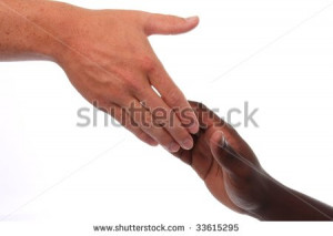 ... -caucasian-hand-reaching-out-to-an-african-hand-in-help-33615295.jpg