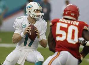 Miami Dolphins quarterback Ryan Tannehill (17) looks to pass as he is ...
