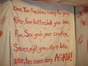 Haunted House hallway idea with scary sayings and strobe light