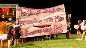 ... high school can display banners with Bible verses at football games