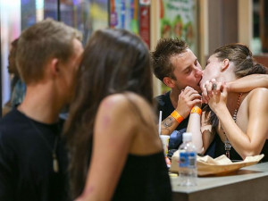 These loved-up schoolies enjoyed a romantic moment amongst the mayhem ...