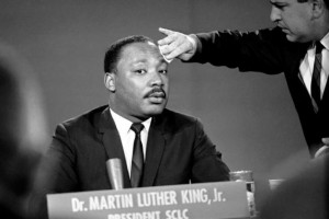 The Rev. Dr. Martin Luther King Jr., of Alabama, waves to the nearly ...