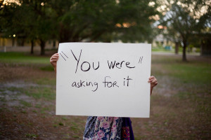 ... assault survivors holding posters with quotes from their attackers (10