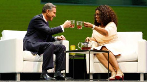 and CEO of Starbucks Coffee Company, clinks tea cups with Oprah ...