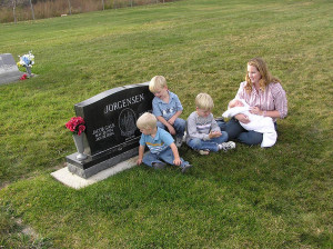 Julie Toone and her sons at the gravesite of her first husband, Jake ...