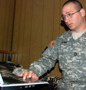 Sgt. 1st Class Anthony Rende, in Iraq, working on a college degree ...