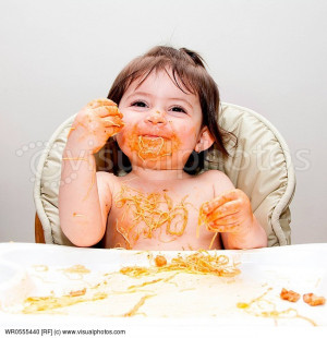 Happy smiling baby having fun eating messy covered in Spaghetti Angel ...