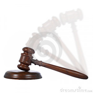 Wooden gavel in action from the court isolated on white background.