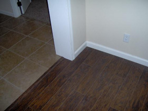 found in the Foyer, Kitchen, Bathrooms and utility room. The Hardwood ...