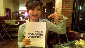 Kaori Takamura, Bilingual Stand-Up Comedian reading How to Conquer ...