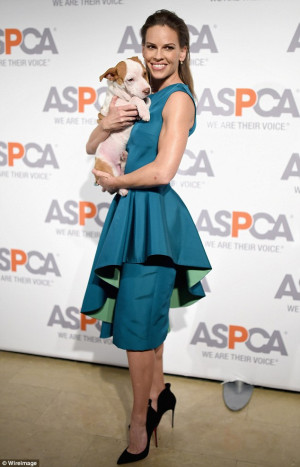 Puppy love! Hilary Swank sparkles in teal and smooches a pooch as she ...