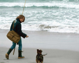 Photo of boy & dog at beach