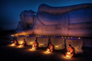 Theravada Thai Buddhist monks meditate under the Buddha entering final ...