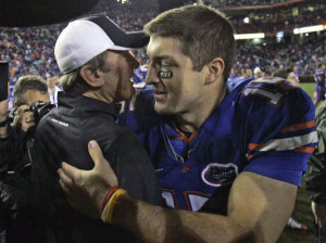 Florida quarterback Tim Tebow, right, greets South Carolina coach ...
