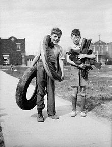 Two boys in Montreal in April, 1942 collect rubber tires and boots to ...