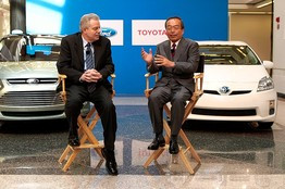 ... Kuzak, left, with Toyota's Takeshi Uchiyamada Monday. Bloomberg News