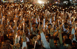 Ahmadabad, India: Indian jewellery industry workers hold candles ...