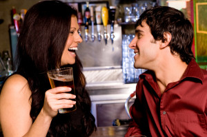 Man and woman flirting at bar