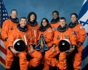 pose for the traditional crew portrait. Seated in front are astronauts ...
