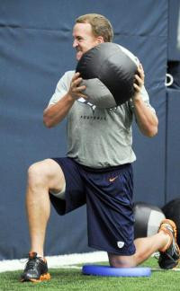 ... medicine ball during NFL football offseason training at Denver Broncos
