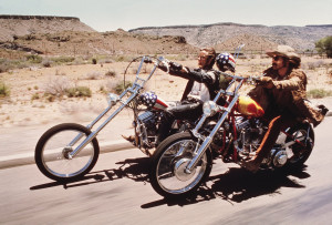 Hippies on bikes – one mostly wearing leather, the other one in a ...