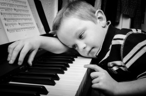Sad Boy Plays Piano by George Hodan