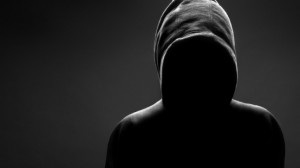 Hooded Ominous Figure Face Invisible In Shadows picture