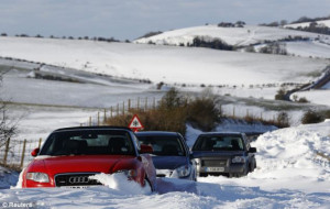 Going nowhere: Cars are stuck in snow on the South Downs near Brighton ...