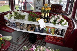 Unique: Julie's coffin covered in flowers and pictures of her loved ...