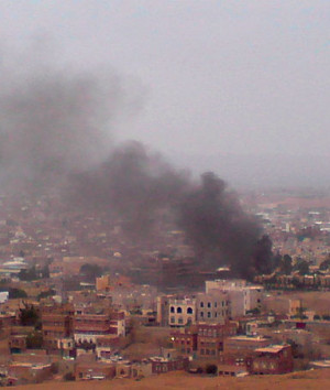 Smoke rises from the area around the U.S. embassy in Sanaa September ...