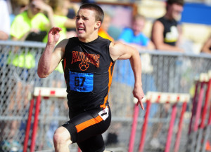 Central York's Jay Stone sprints before the last hurdle during the 300 ...