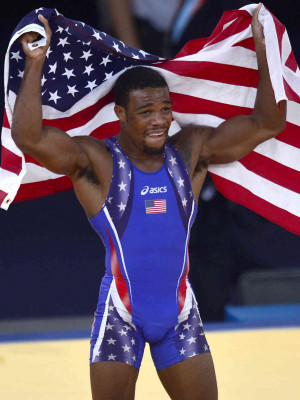 Jordan Burroughs celebrates with the U.S. flag after defeating Iran's ...