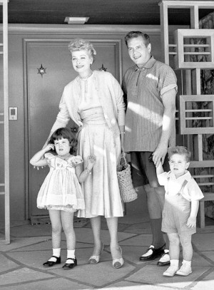 Lucille Ball and Desi Arnaz photographed outside their home with their ...