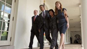 walks with, from left, current National Security Adviser Tom Donilon ...