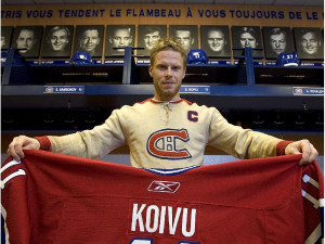 Canadiens captain Saku Koivu displays current hockey sweater while ...