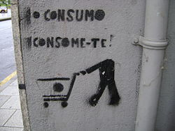 An anti-consumerist stencil graffiti saying 