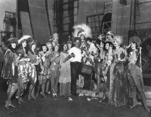Will Rogers backstage with the 1924 “Ziegfeld Follies” cast. Image ...