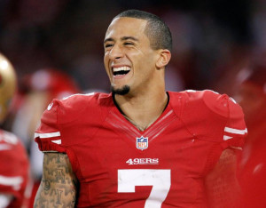 San Francisco 49ers quarterback Colin Kaepernick (7) smiles on the ...