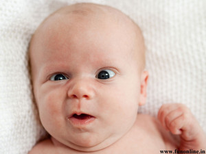 Cute Baby making Funny Faces Wallpaper