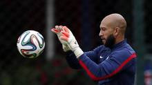United States' goalkeeper Tim Howard works out during a training ...